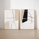 Minimalist abstract diptych featuring flowing black lines and shapes against cream backgrounds.