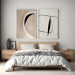 Modern bedroom with wooden bed, minimalist decor, and abstract black and beige artwork.