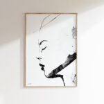 Minimalist black ink profile drawing in simple wooden frame on white wall.