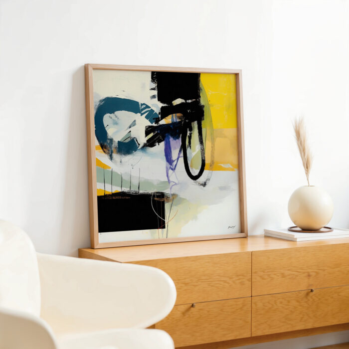 Vibrant abstract painting with blue, black and yellow brushstrokes displayed on wooden credenza.