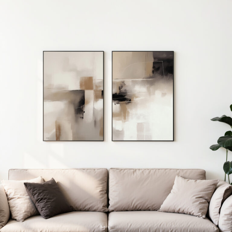 Abstract art duo in beige and black tones above neutral sofa with decorative pillows.