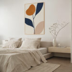 Abstract botanical artwork in navy and rust tones above minimalist neutral bedroom setting.