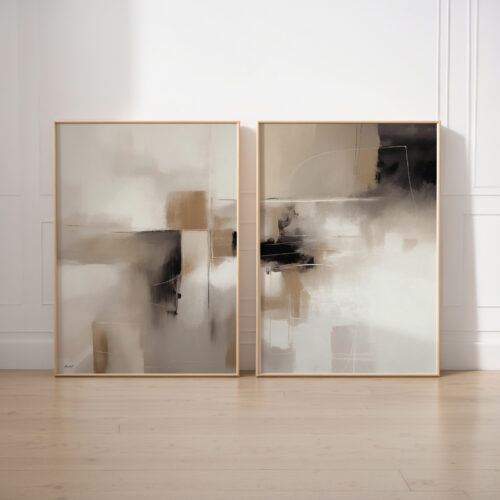 Elegant abstract prints in neutral tones, framed in light wood against white wall.
