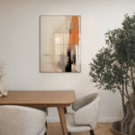 Abstract terracotta artwork above wooden table with chairs and potted plant in minimalist interior.