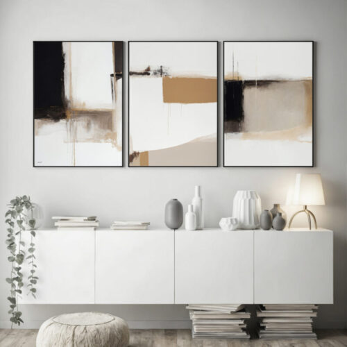 Abstract triptych artwork over sleek white cabinet with minimalist decor