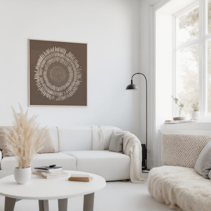 Minimalist living room with circular brown wall art and white curved sofa.