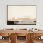 Abstract landscape painting with soft pastels above wooden mid-century dining table and chairs.