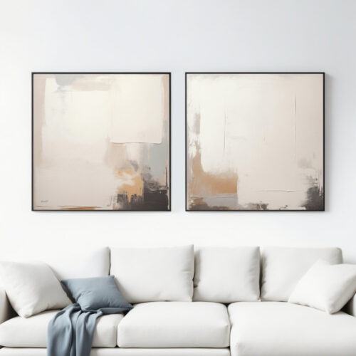 Two minimal abstract paintings in neutral tones hanging above a white sofa