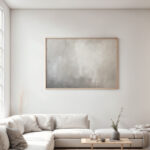Abstract foggy gray painting above white sofa in minimalist modern living room