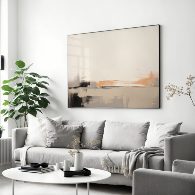 Abstract canvas art in beige, orange and gray tones above modern sofa.