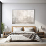 Abstract artwork with neutral tones in modern minimalist bedroom with natural light.
