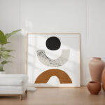 Minimalist living room featuring abstract geometric artwork and earthy terracotta vases against white walls.
