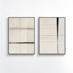 Minimalist line art prints in neutral tones, framed in black on white wall.
