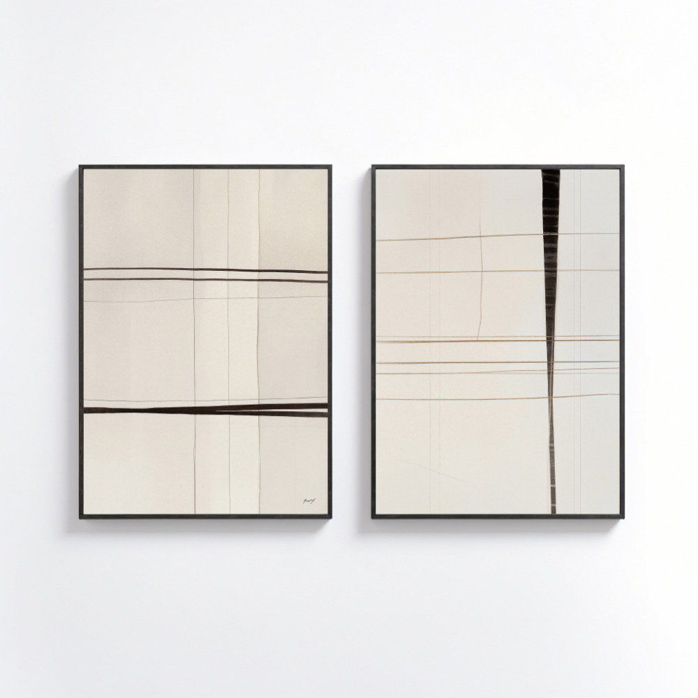 Minimalist line art prints in neutral tones, framed in black on white wall.