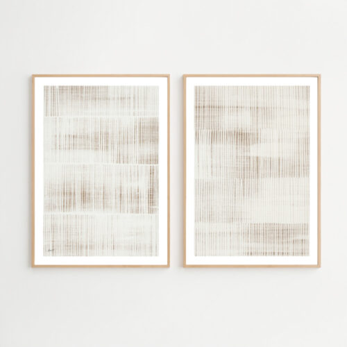 Pair of minimalist line art prints with delicate beige patterns in wooden frames.