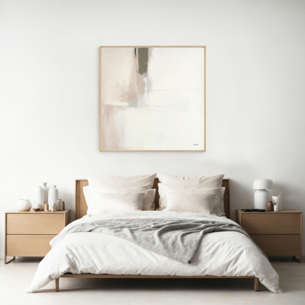 Minimalist bedroom featuring neutral abstract wall art above wooden bed with white linens.