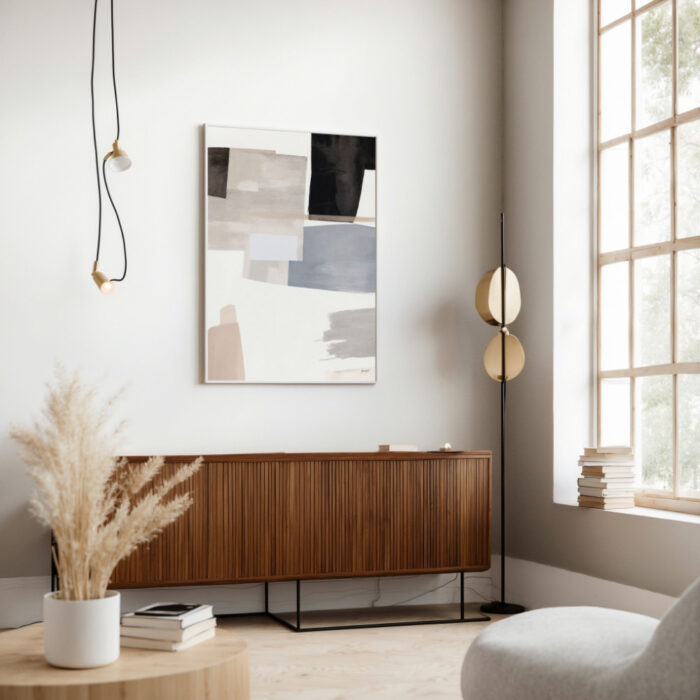 Minimalist interior with wooden credenza, abstract artwork, and natural light.