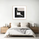 Minimalist bedroom with wooden platform bed and geometric abstract art above headboard.