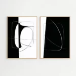 Minimalist black and white abstract diptych with curved lines in wooden frames.