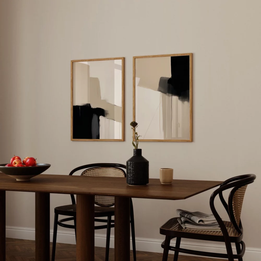 Minimalist dining area with wooden table, bentwood chairs and abstract wall art.