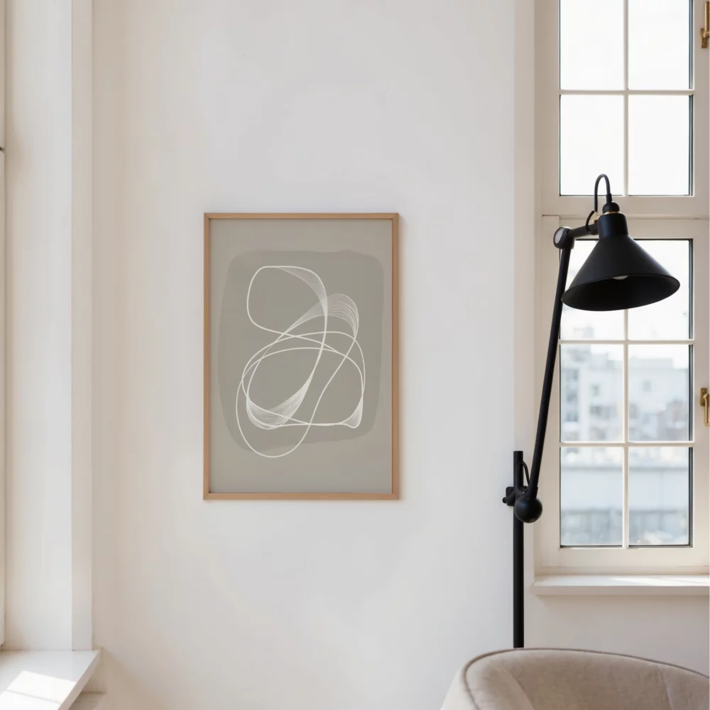 Minimalist interior with abstract wall art, window and black adjustable lamp.
