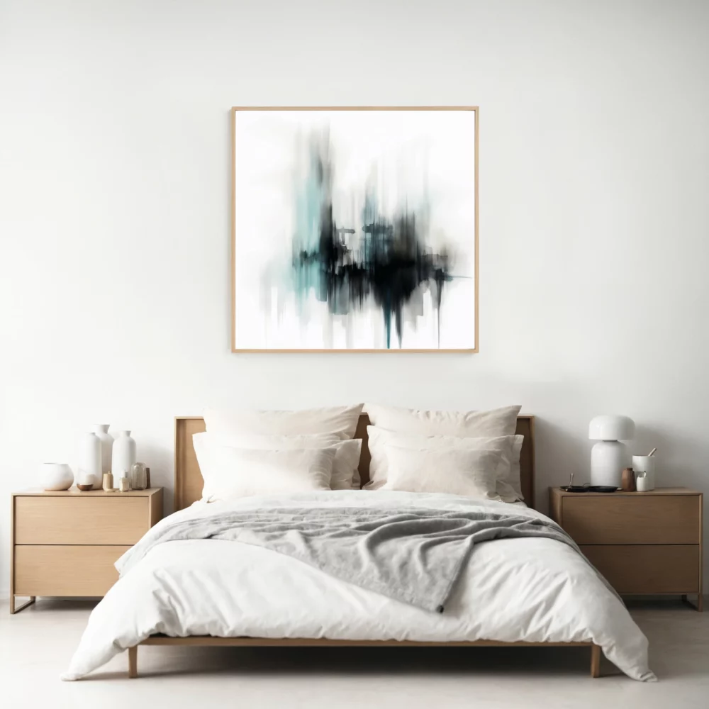 Minimalist bedroom with wooden bed frame, white duvet and abstract wall art.