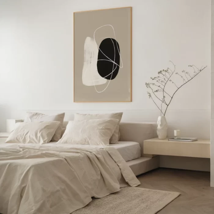 Minimalist beige bedroom with platform bed, abstract wall art and dried botanicals.