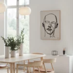 Minimalist Scandinavian dining room with wooden furniture, line art, and natural light.