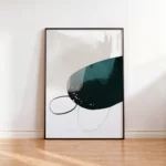 Modern abstract art with green shape and thin black lines against white wall.