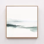 Minimalist abstract landscape watercolor in wooden frame on white wall.