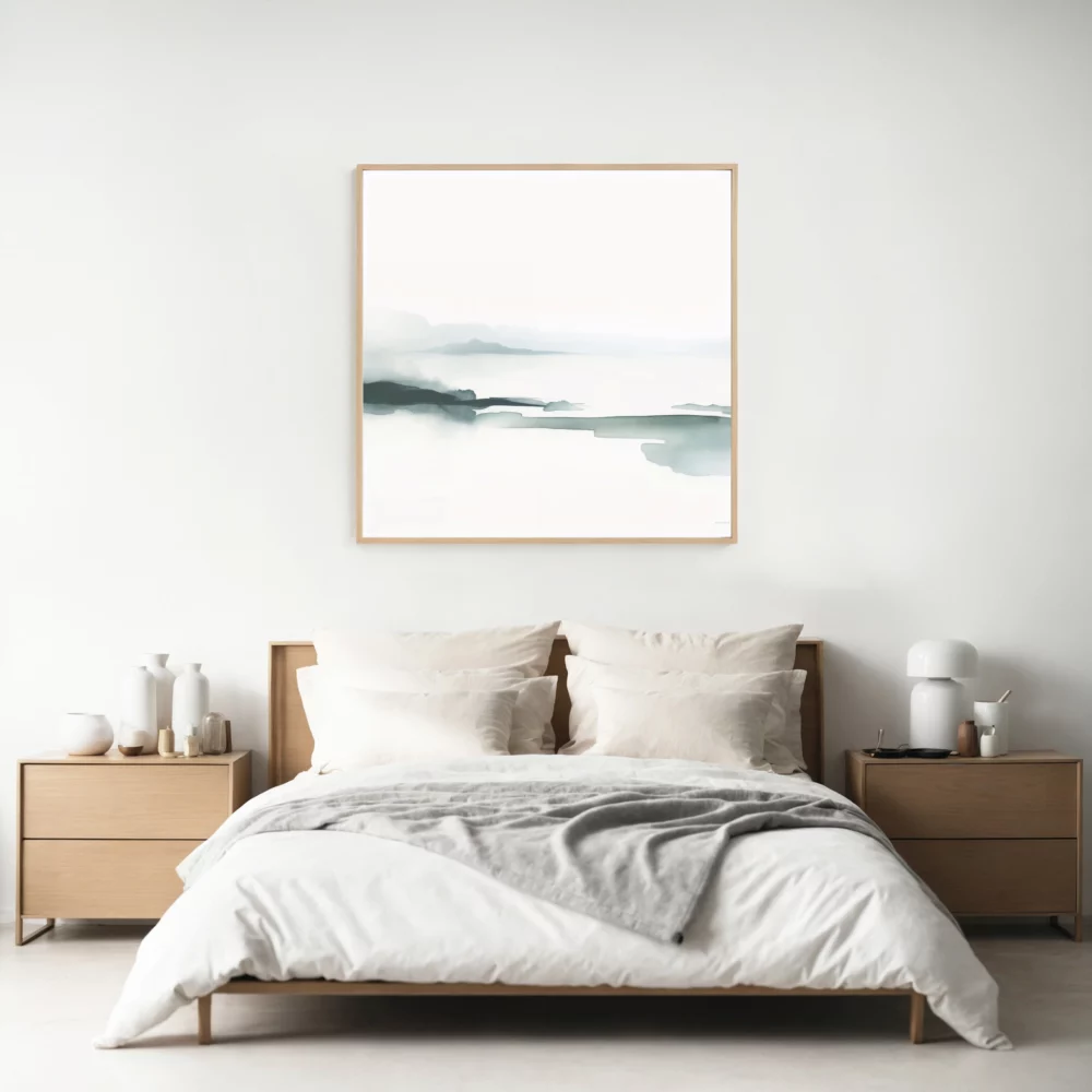 Minimalist bedroom with white bedding, wooden accents and abstract teal artwork.
