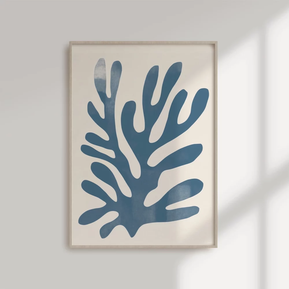 Minimalist blue coral artwork in wooden frame on white wall.