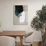 Minimalist dining area with abstract geometric artwork and indoor plant.
