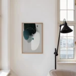 Minimalist white interior featuring abstract art with teal shapes and black lamp.