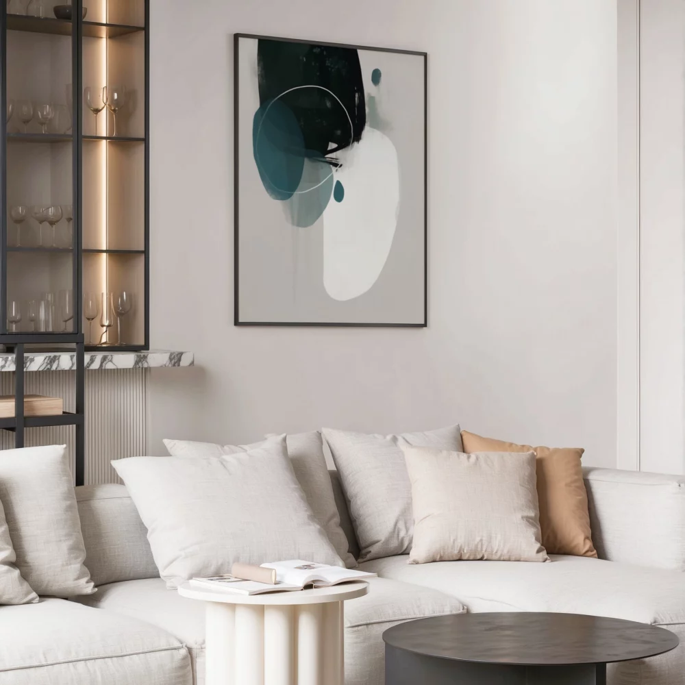 Minimalist living room with abstract teal artwork above white sectional sofa.