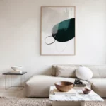 Minimalist living room with cream sectional sofa and abstract wall art.