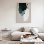 Minimalist living room with cream sectional sofa and abstract wall art.