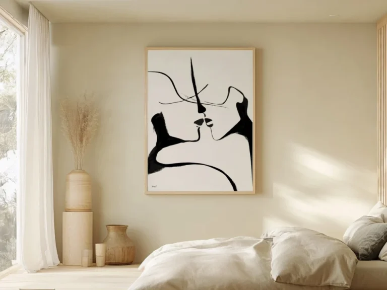Minimalist bedroom with abstract art on wall featuring neutral color palette.