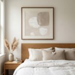 Neutral tone drifting shapes fine art print above minimalist bedroom headboard
